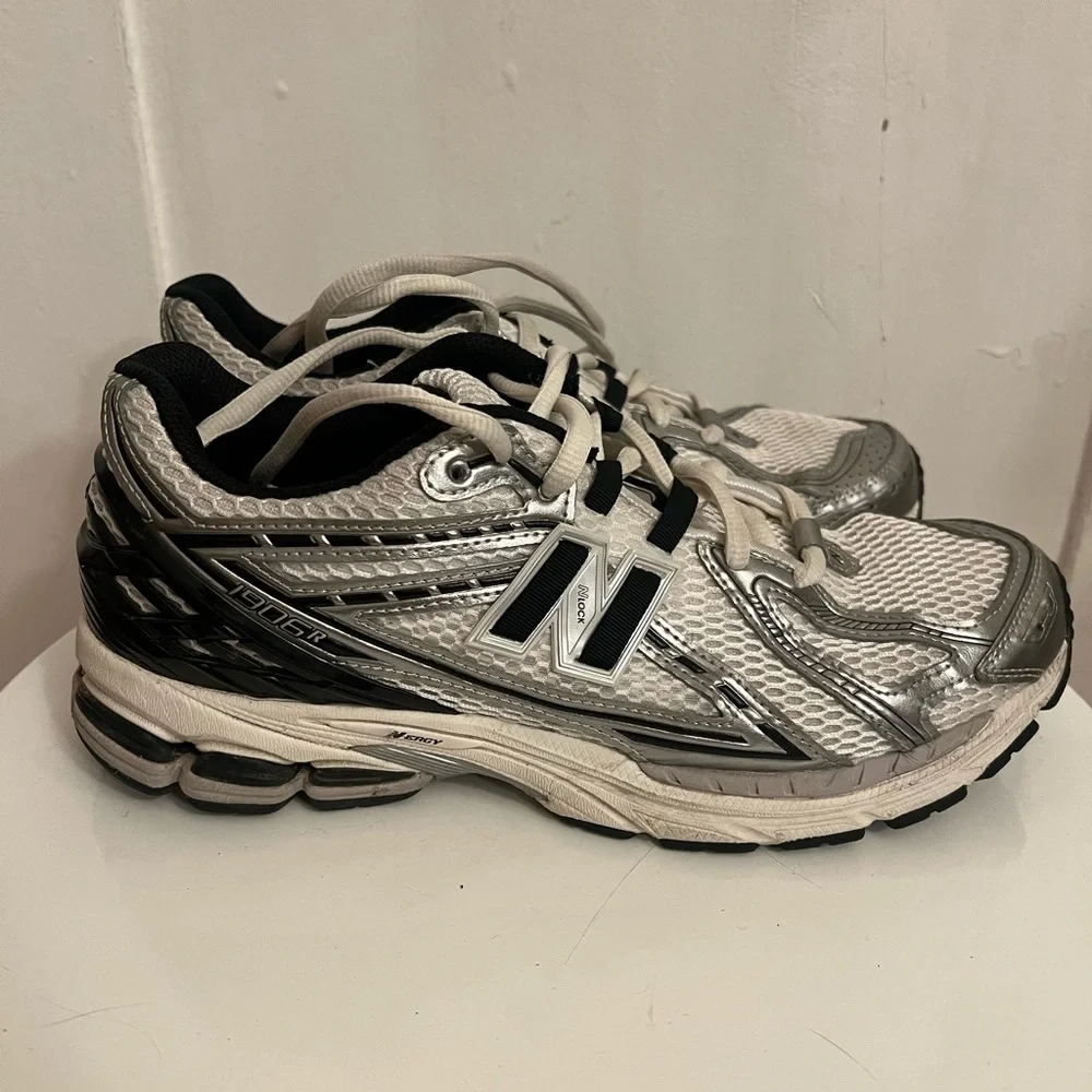 New Balance 1906R sneakers in the Silver Metallic and Black colorway. Size 10.